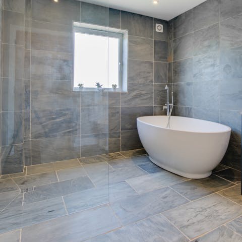 Unwind with a calming soak in the freestanding tub