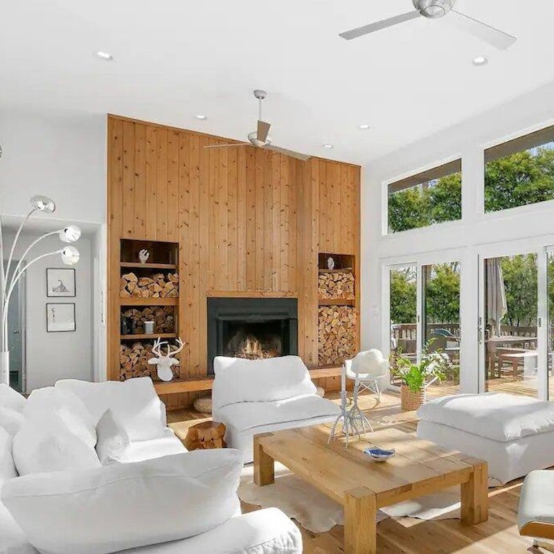 Cosy up in the stylish living room, with a log fire for cooler evenings
