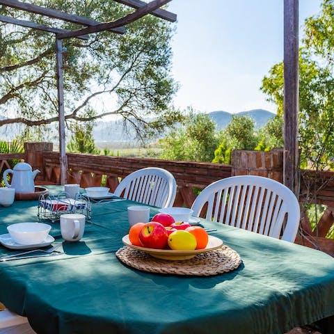 Tuck into alfresco feasts looking out over the nearby mountains