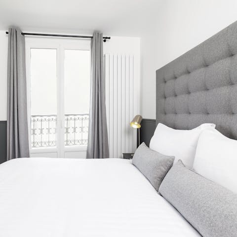 Wake up in the peaceful bedrooms and enjoy views of your 10th arrondissement neighbourhood from the French windows 