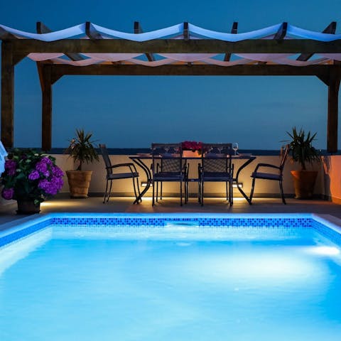 Dive into the pool for a swim under the stars