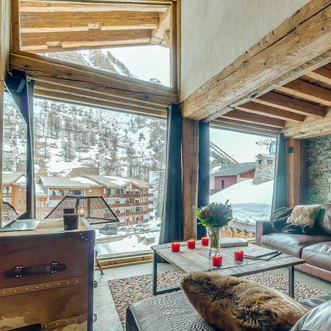 Chill out in the living space with its incredible mountain views