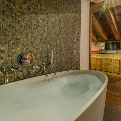 Take a luxurious soak in the bathtub after a busy day 