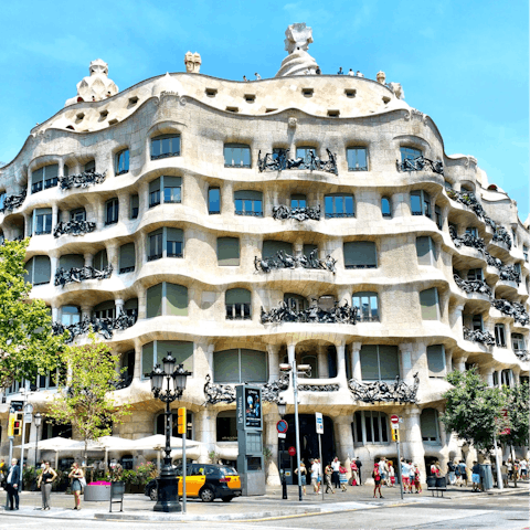 Take a tour around the Gaudi-designed Casa Milà,  just over ten minutes away on foot
