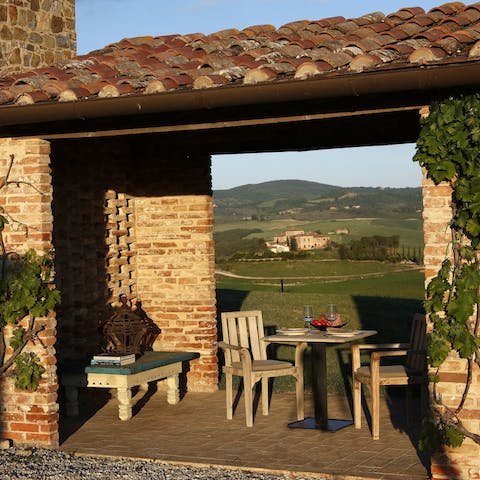 Enjoy golden hour from the rustic loggia with a drink in hand