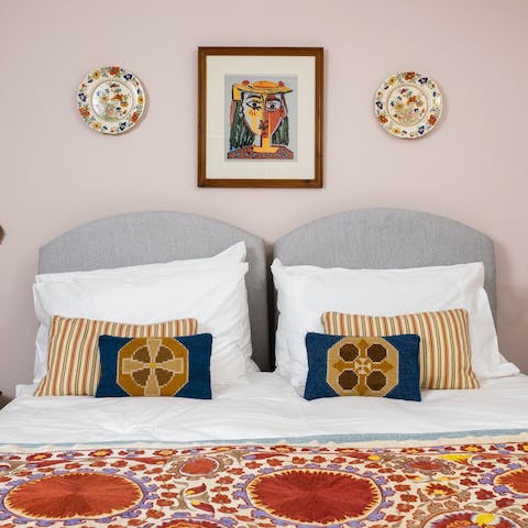 Sleep easy in the comfortable bedrooms upstairs, filled with cosy blankets and antique furniture
