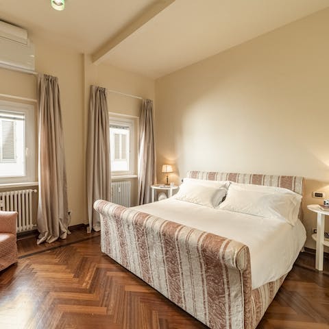 Draw the black-out drapes in the elegant bedroom