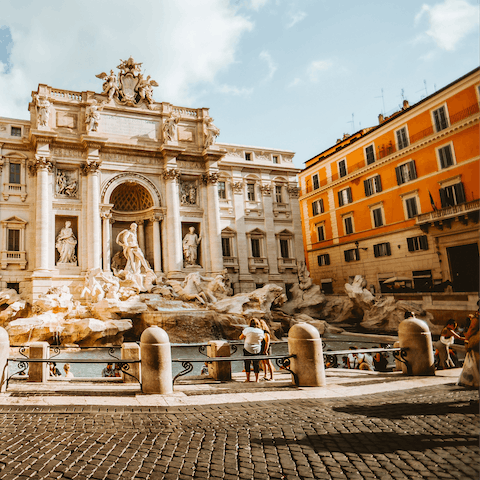 Throw a coin in the glistening waters of the Trevi Fountain, fourteen minutes from home