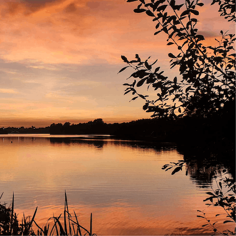 Watch the sunset from Whitlingham Broad, only a twenty–minute drive away