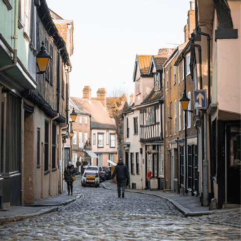 Wander the cobbled streets of Norwich, just a twenty–two–minute drive away