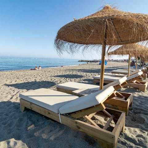 Walk just 50 metres to the soft sand of Playa Puerto Banus