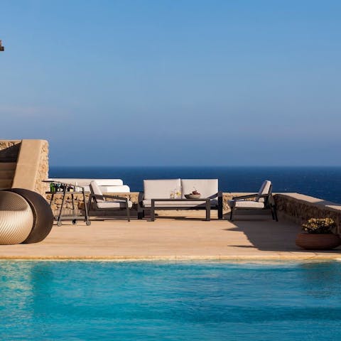 Sip cocktails by your private infinity pool after a gentle afternoon dip