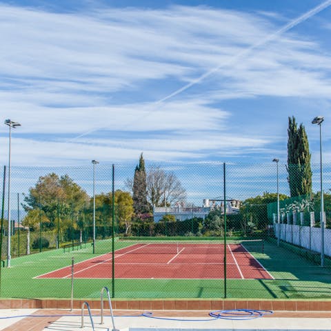 Challenge each other on the tennis court as you play a few sets