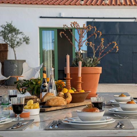 Sample local delicacies on the courtyard, under the shade the pergola