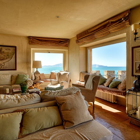 Settle in to one of the window seats and gaze out at the sea