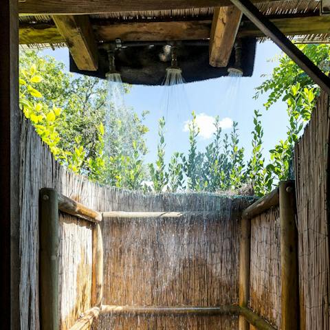 Take a refreshing outdoor shower after a busy day of exploring 