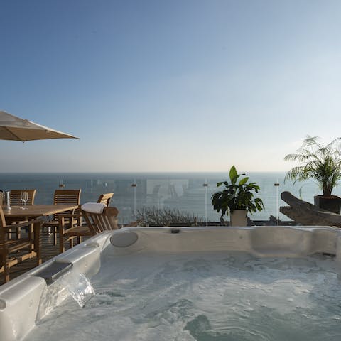 Relax and unwind in the luxurious hot tub with marvellous views