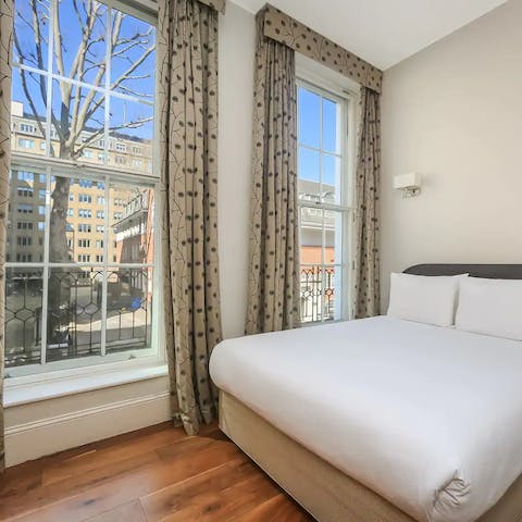 Wake up to street views from grand, floor-to-ceiling windows