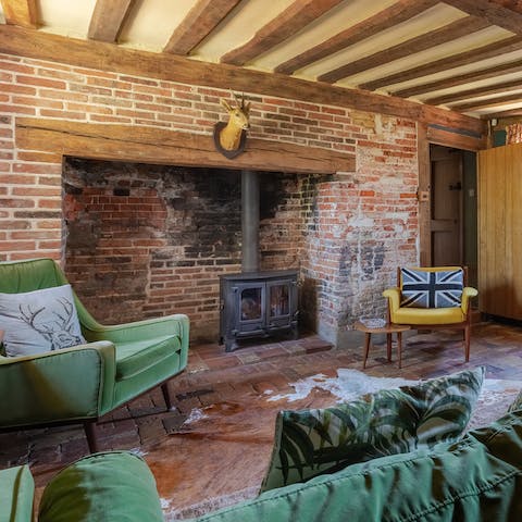 Feel at home in the characterful cottage with its charming beams, brick floor and inglenook fireplace