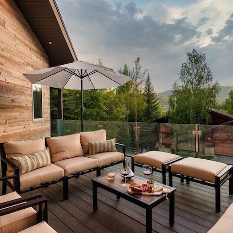 Settle into the sofas on the terrace with a treeline view