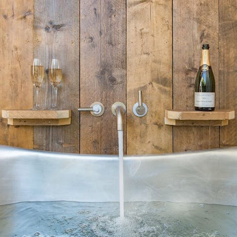 Sip champagne in the outside bathtub