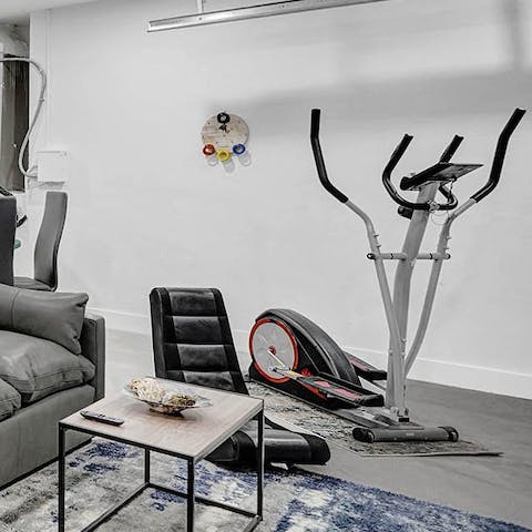 Keep on top of your fitness with the work out machine in the games room 