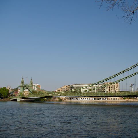 Stroll along the Thames towards Hammersmith Bridge, a thirteen-minute walk away 