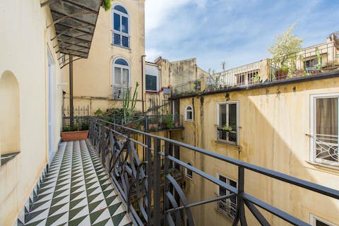 Enjoy a fresh breeze from the inner courtyard balcony while enjoying a glass of wine