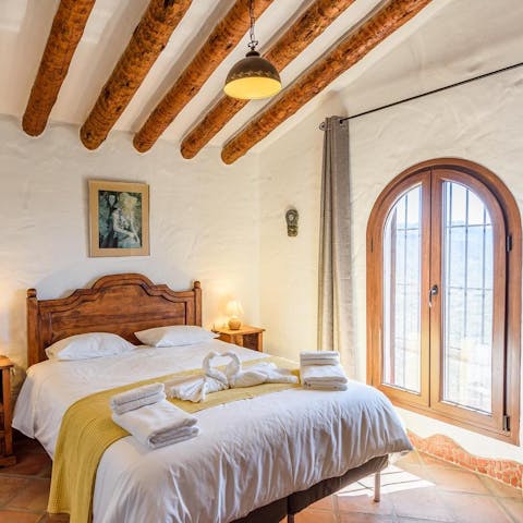Wake up peacefully in your light-filled traditional bedroom, the mountains outside your window