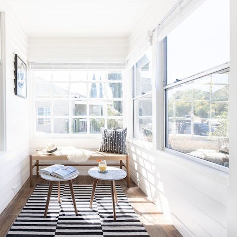 Read a book in the light-filled sun room