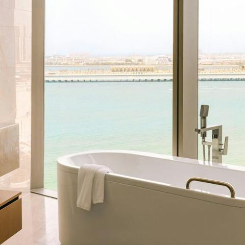 Enjoy an indulgent soak looking out over Palm Jumeirah