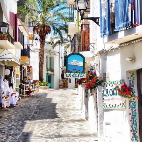 Take the fifteen-minute drive into Ibiza's old town and stroll along the charming streets