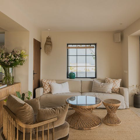 Put your feet up in the boho-chic living space at the end of a busy day exploring the White Isle