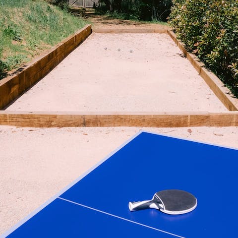 Challenge friends to a game of ping pong under the sun