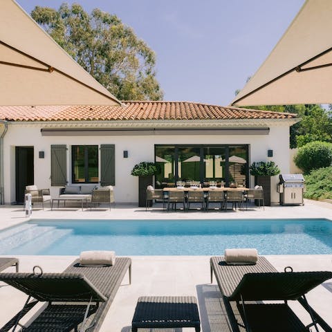 Lie back by the private pool after a refreshing dip in the water