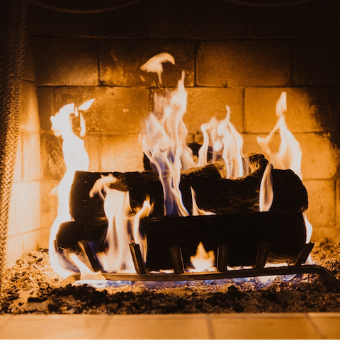 Cosy up around the fireplace after a long day of exploring