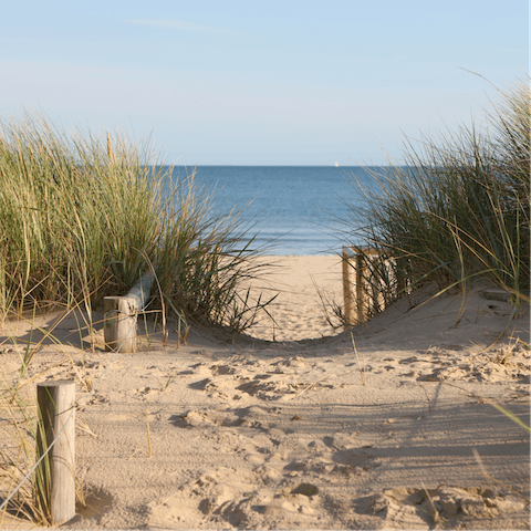Stroll along the golden sand at Westward Ho! Beach – a fourteen-minute drive away