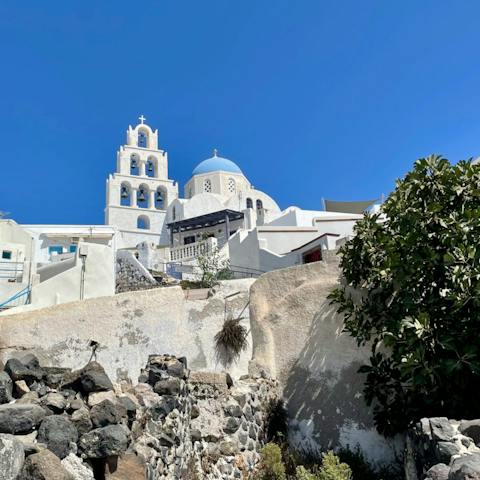 Drive five minutes or walk into Pyrgos, a pretty white-washed town with scenic viewpoints
