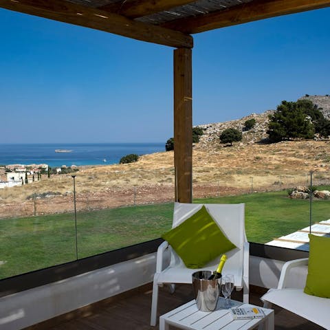 Head to the first floor balcony and take in the sea view