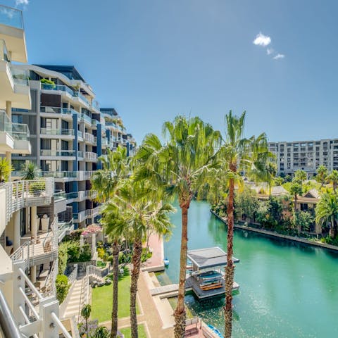 Admire striking views of the marina and palm trees from your private balcony