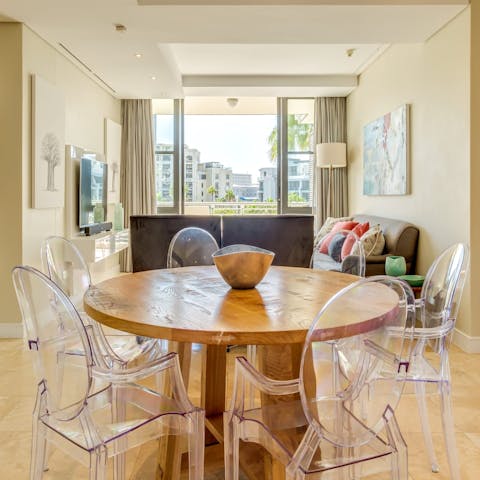 Sit on ghost chairs around the dining table while a private chef prepares dinner