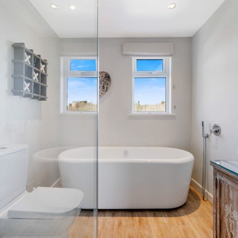 Treat yourself to a relaxing soak in freestanding bathtub
