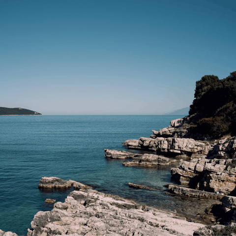 Spend a day in Kassiopi where you can swim off the rocks of Kanoni, a short drive away