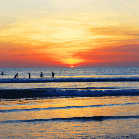 Stroll down to nearby Pantai Batu Belig beach for incredible sunsets
