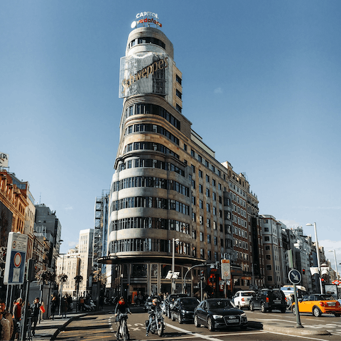 Spend an afternoon shopping on the Gran Vía, a thirteen-minute walk from home