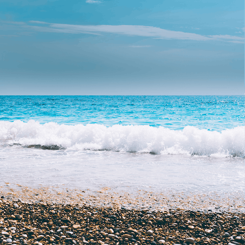 Dip your toes in the crystal-clear waters of Barbati beach, based a short walk away