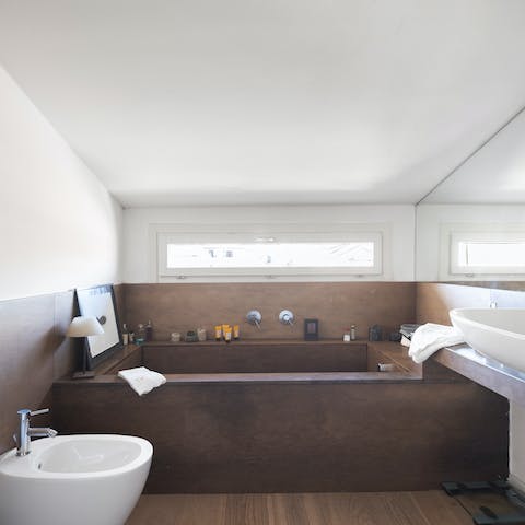 Treat yourself to a relaxing soak in the sleek bathtub