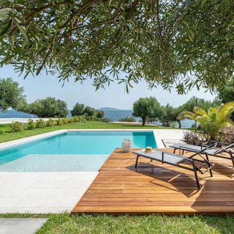 Splash about in the home's private swimming pool and dry off on a sun bed