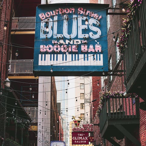 Follow the jazz beats down to Bourbon Street, just a ten-minute drive away
