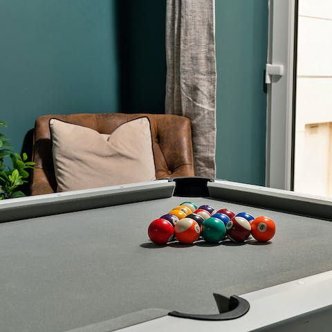 Grab a cue and challenge friends and family to a game of pool